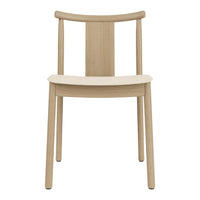 Light natural wood chair with a smooth, minimalist design and clean lines, showcasing warm beige tones.