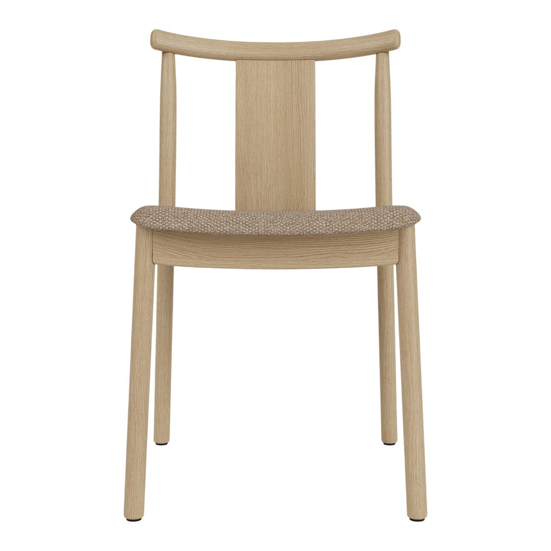 Light oak wooden chair with a simple design and a natural cork seat. Perfect for minimalist decor.