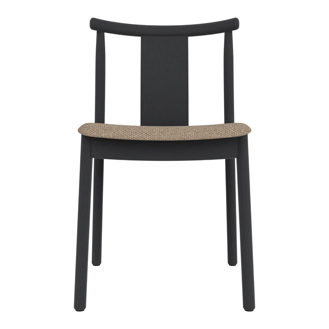 Black wooden chair with a simple design, featuring a natural cork seat for a stylish contrast.