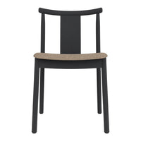Black wooden chair with a simple design, featuring a natural cork seat for a stylish contrast.