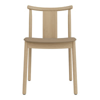 Light oak wooden chair with a simple, minimalist design and natural finish, showcasing a smooth texture.