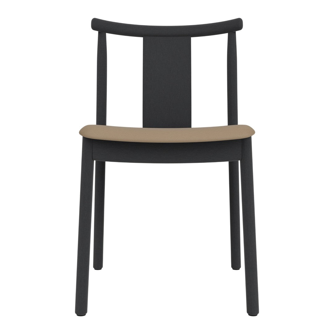 Black chair with a smooth tan seat and minimalist design, perfect for modern decor.