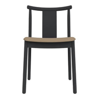 Black chair with a smooth tan seat and minimalist design, perfect for modern decor.