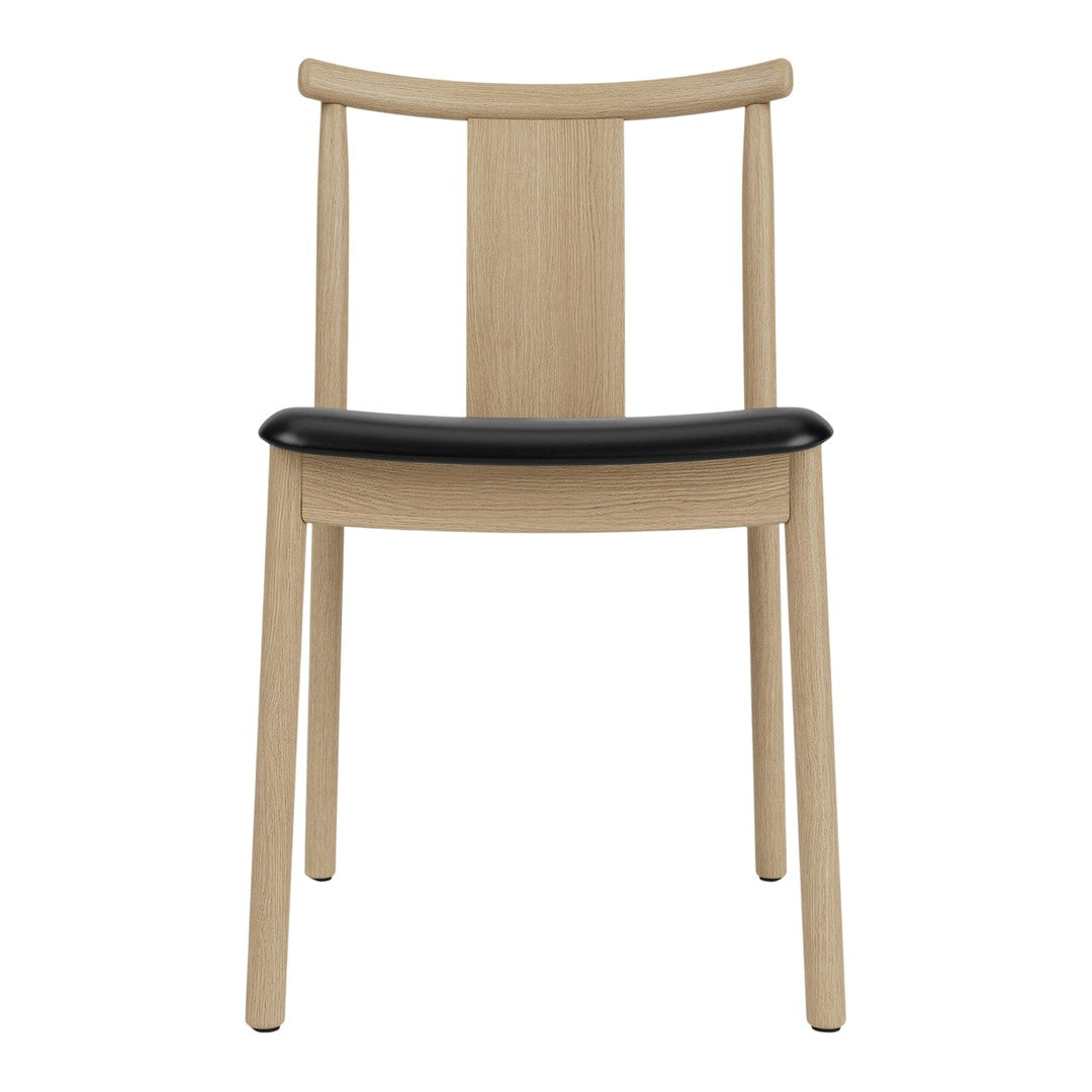 Beige wooden chair with a sleek black seat, featuring a minimalistic and modern design.