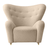 Beige upholstery armchair with a textured, fluffy pattern and tufted backrest, perfect for cozy interiors.