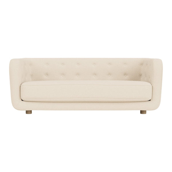 Cream upholstered sofa with a smooth texture and button-tufted design. Elegant and modern style for any living space.