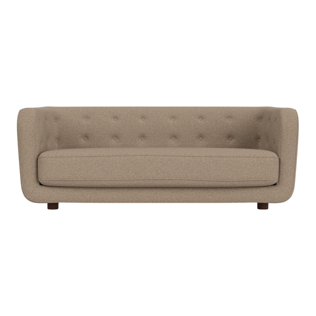 Beige tufted sofa with a smooth texture and simple, clean lines, ideal for modern decor.