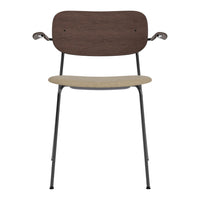 Brown wood backrest, beige seat, and sleek black metal legs create a modern and minimalist chair design.