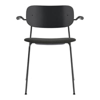 Black chair featuring a smooth backrest and textured seat, with sleek metal legs for a modern look.