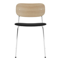 Wooden backrest in light tan, black cushioned seat, chrome legs for a modern accent in any space.