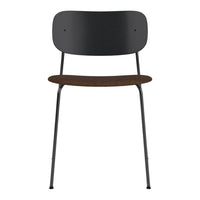 Black metal chair with wood grain seat, minimalist design, and smooth lines. Perfect for modern decor.