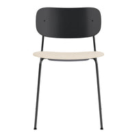 "Black metal chair with a smooth beige seat, minimalist design, perfect for modern interiors."
