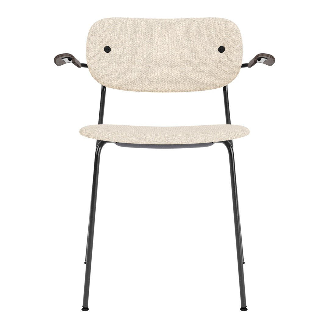 Beige chair with a smooth finish and black metal legs, featuring minimalistic design and rounded edges.