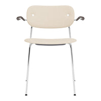 Beige fabric chair with chrome legs and armrests, featuring a minimalist design and smooth, clean lines.