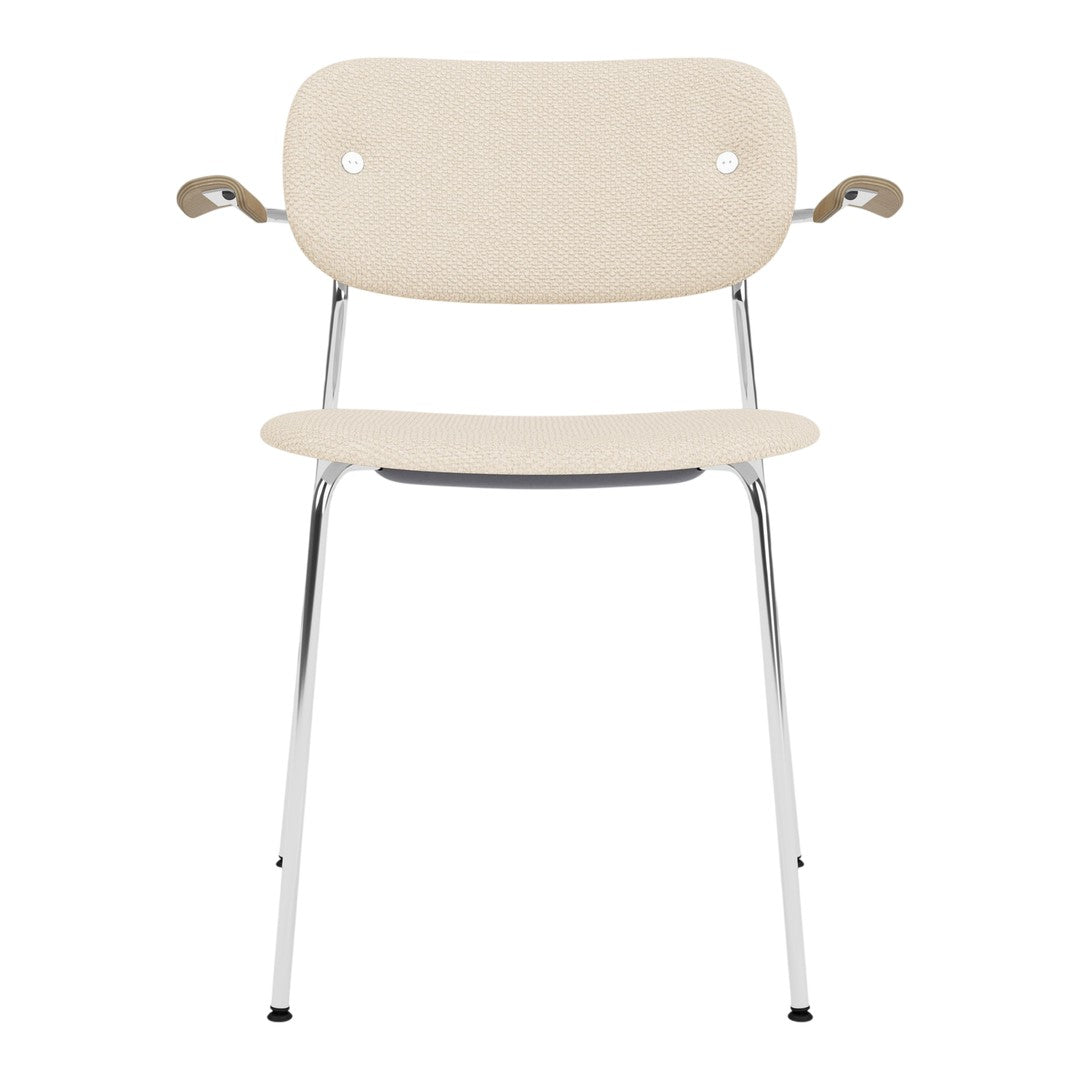 Beige chair with seamless design, chrome legs, and minimalist armrests for a modern touch.
