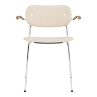 Beige chair with seamless design, chrome legs, and minimalist armrests for a modern touch.