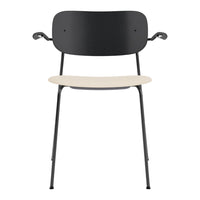 Black metal chair with a minimalist design and a contrasting light beige seat. Perfect for modern decor.