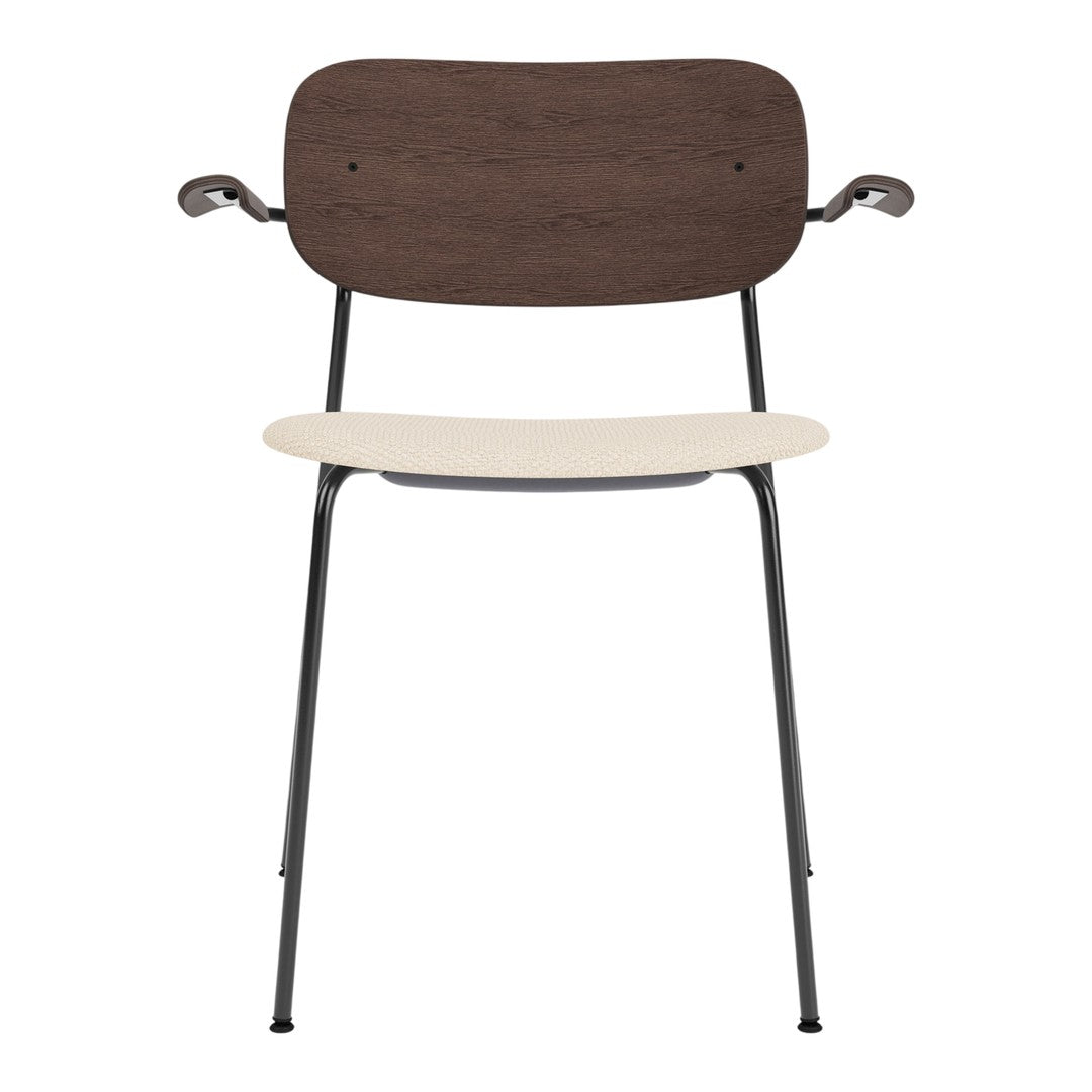 Wooden chair with a dark brown back, cream seat, and black metal legs; modern, minimalist design.