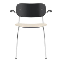 Black and light wood dining chair with chrome legs, featuring a minimalist design and smooth color contrast.