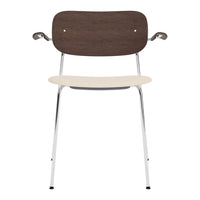 Stylish chair with a dark wooden backrest, creamy seat, and sleek chrome legs, perfect for modern decor.