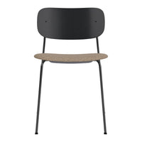 Stylish black metal chair with a natural cork seat, featuring a sleek and modern design. Ideal for contemporary spaces.