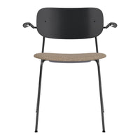 Black metal chair with a natural cork seat, featuring sleek, minimalist design and smooth lines.