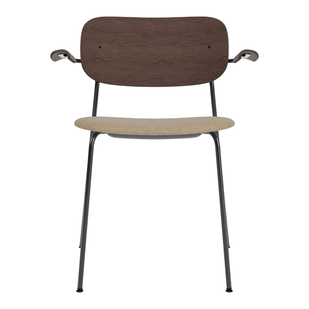 Modern chair featuring a dark wood backrest, light beige seat, and sleek black metal legs. Stylish and functional design.