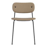 Tan chair with a smooth surface, black legs, and minimalist design. Ideal for modern decor.