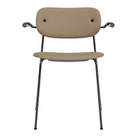 Tan chair with a minimalist design, featuring a smooth surface and black metal legs. Perfect for modern decor.