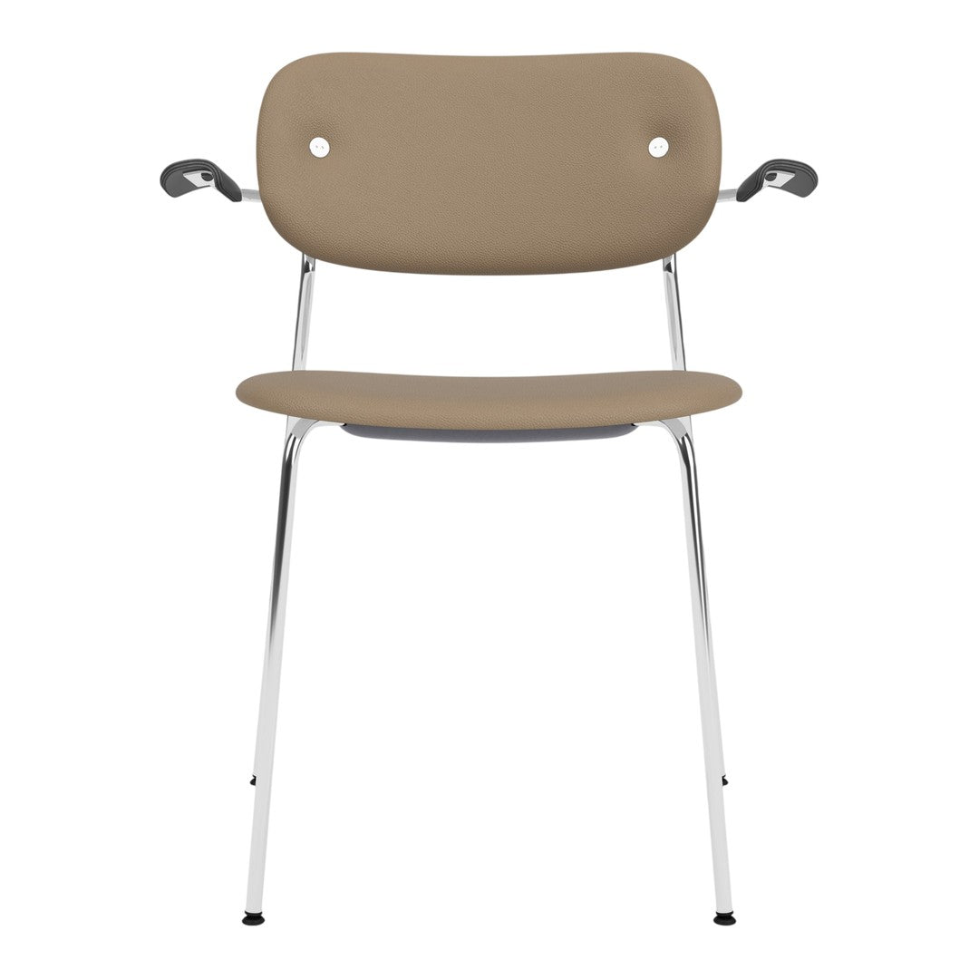 Tan chair with a smooth, minimalist design and chrome legs, featuring subtle rounded edges and armrests.