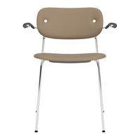 Tan chair with a smooth, minimalist design and chrome legs, featuring subtle rounded edges and armrests.