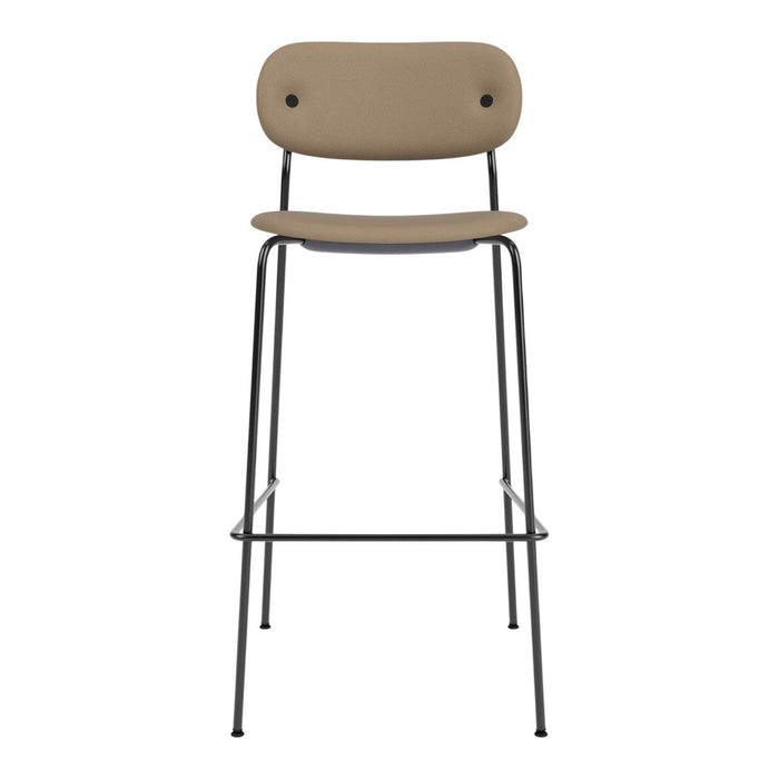 Tan upholstered bar stool with minimalist design and sleek black metal legs. Perfect for modern interiors.