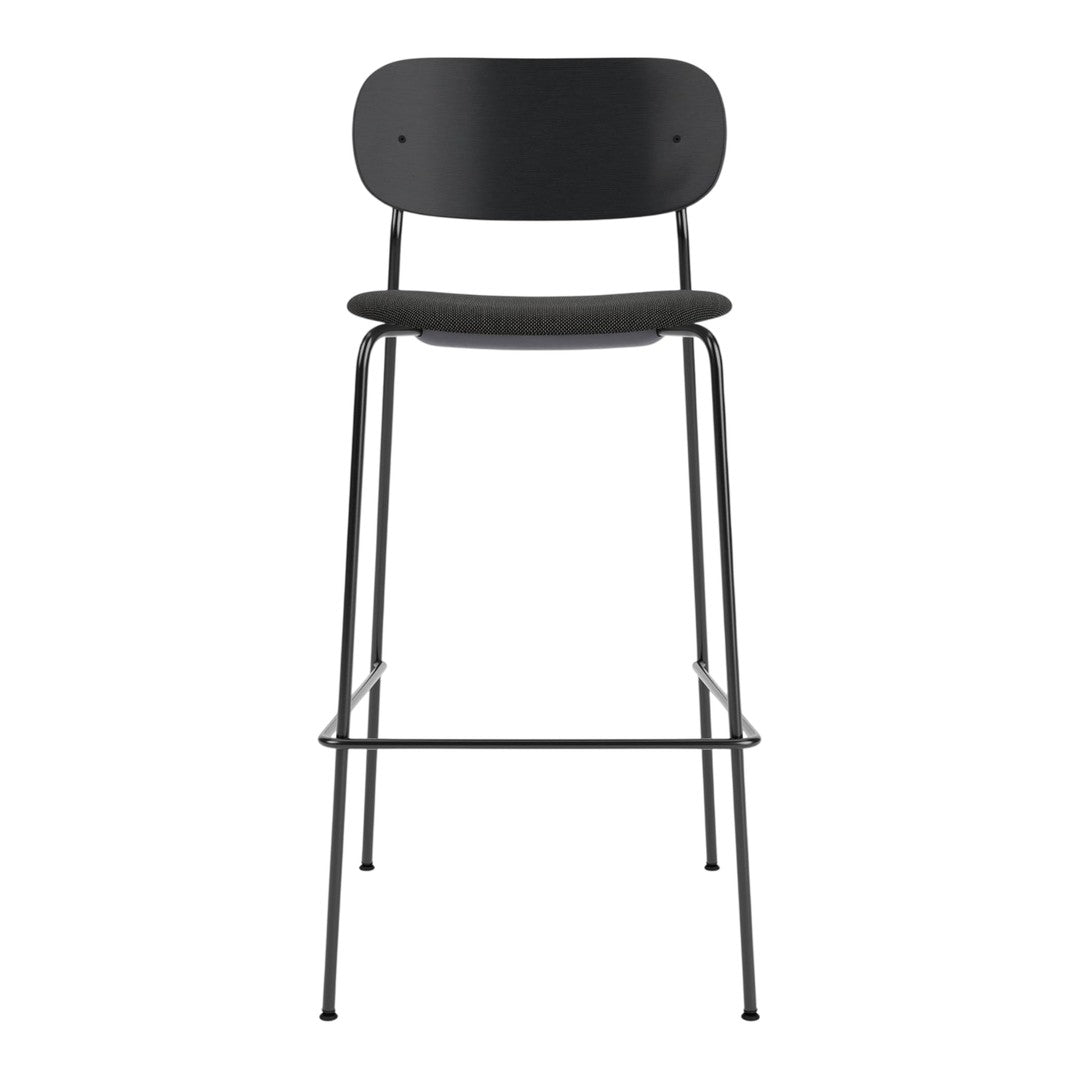 Black metal bar stool with a minimalist design, featuring a smooth matte finish and simple round patterns.