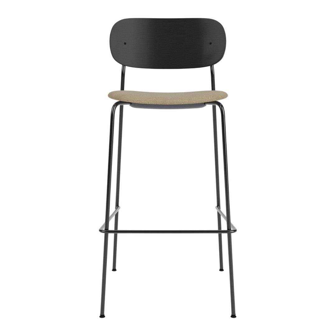 Black and natural wood bar stool with a minimalist design and sleek lines. Perfect for modern decor.