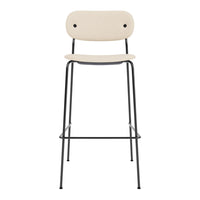Beige high stool with a sleek black metal frame and minimalist design. Ideal for modern spaces.