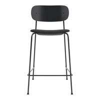 Black metal bar stool with a sleek, minimalist design and clean lines, ideal for modern home decor.
