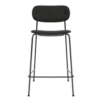 Stylish black bar stool with a sleek, curved design and matte finish, perfect for modern interiors.