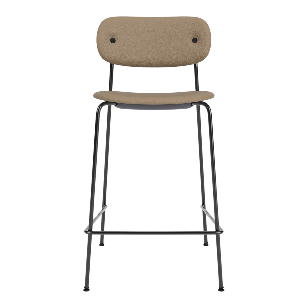 Tan upholstered stool with a sleek black metal frame, featuring a minimalist design and round backrest.