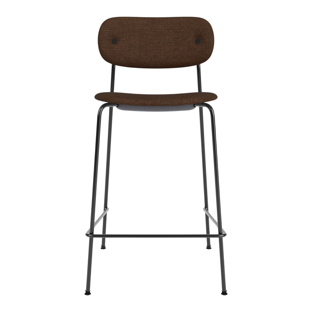 Brown upholstered bar stool with a minimalist design and black metal legs. Perfect for modern interiors.