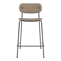 Beige patterned seat with a sleek black metal frame, ideal for modern interior decor.