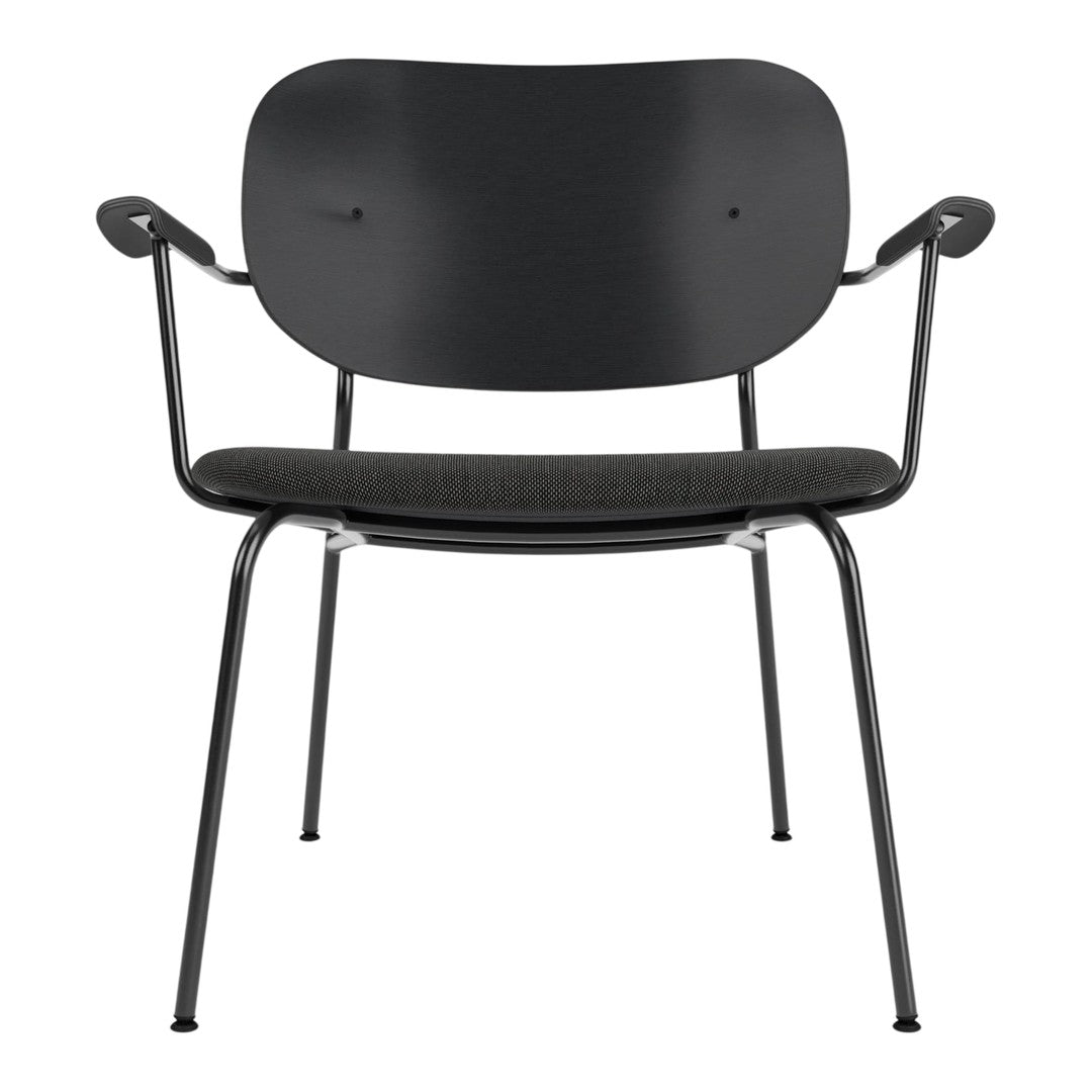 Black chair with a minimalist design featuring a smooth, rounded back and textured seat. Sleek metal legs.