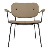 Tan upholstered chair with black metal frame and two distinctive button accents on the backrest. Modern and stylish design.
