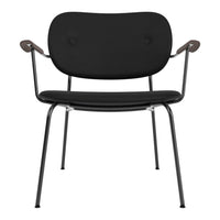 Black chair with smooth upholstery and sleek metal frame, featuring a minimalist design and subtle curved accents.