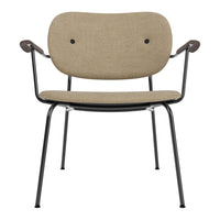 Beige upholstered chair with black metal frame and curved armrests, featuring minimalist design and subtle textures.