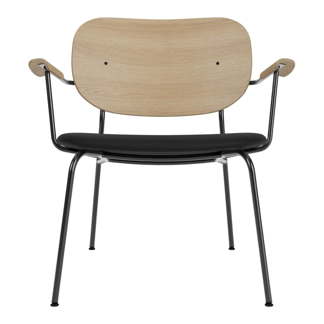 Wooden chair with a natural finish and black leather seat, featuring sleek metal legs and smooth curves.