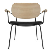Wooden chair with a natural finish and black leather seat, featuring sleek metal legs and smooth curves.
