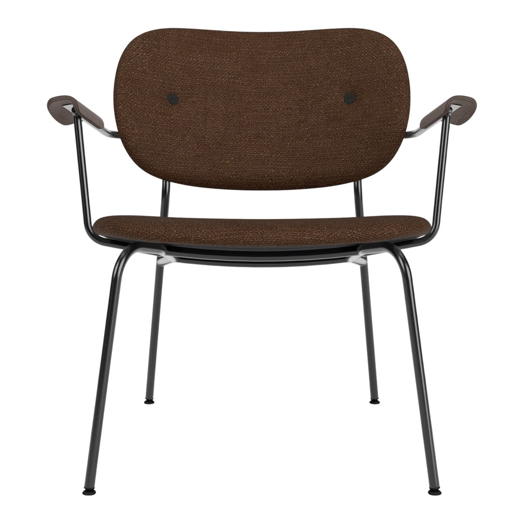 Brown upholstered chair with a minimalist design and black metal legs. Unique button accents add subtle texture.