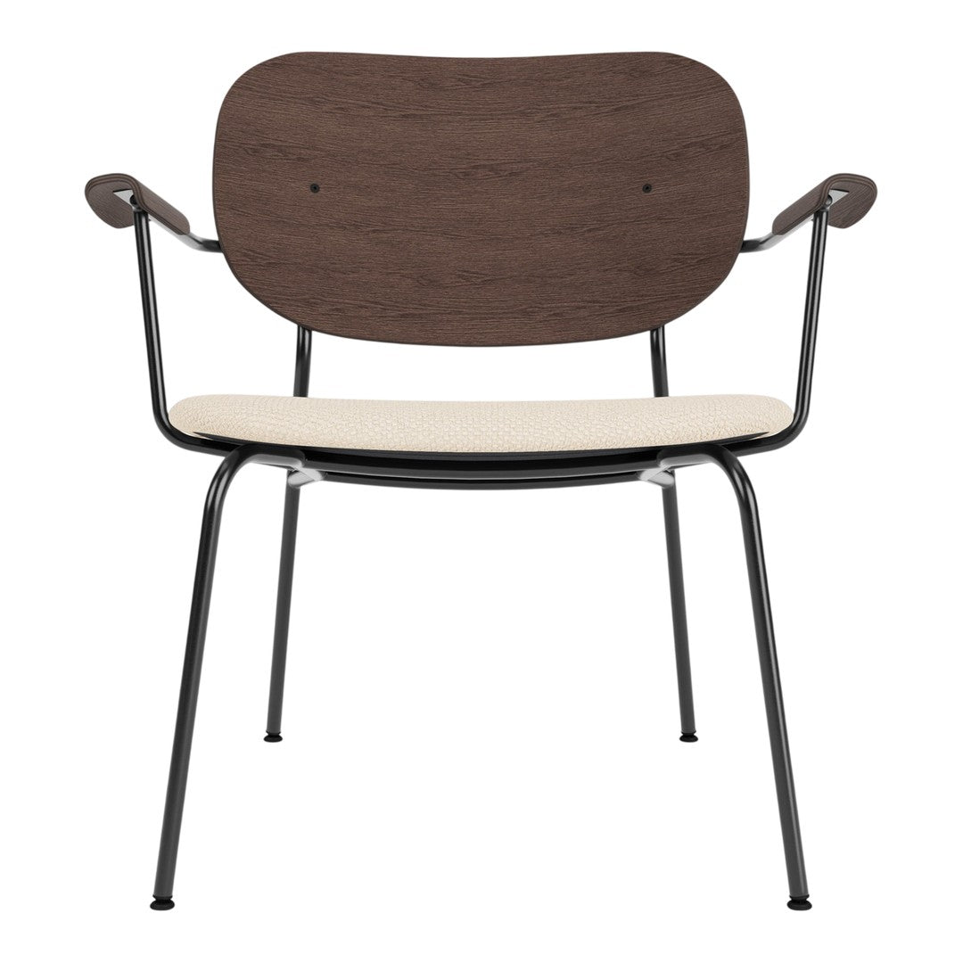 Brown wooden backrest, cream seat, and black metal frame dining chair. Stylish minimalist design for modern decor.