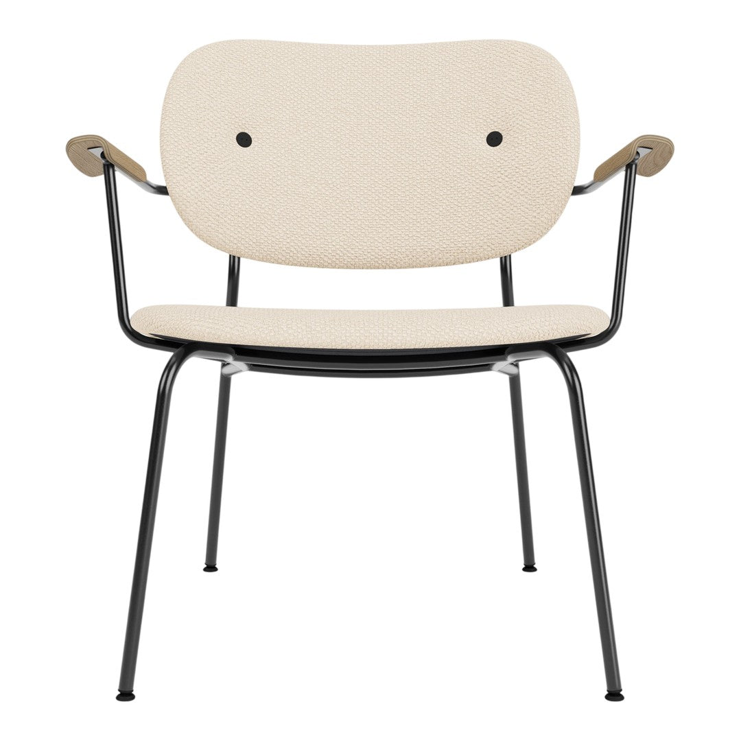 Beige chair with a minimalist design, featuring a cream upholstery and black metal legs. Modern and stylish.