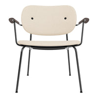 Beige fabric chair with a minimalist design and sleek black metal frame, featuring curved armrests.